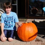 October - Alex and our home grown pumpkin (59 lbs.)