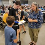 Alex endlessly signing autographs at the Rubik's cube National Champs