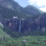 Cool waterfall above Telluride with adjacent, old power generating building