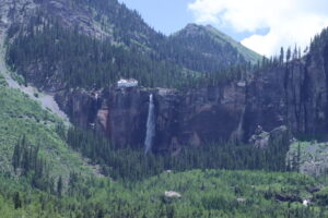 Cool waterfall above Telluride with adjacent, old power generating building