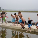 Polar penguin plunge every morning-Alex in green trunks