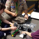 Alex and Adam face-off with their 'blast cars' at the Erie Town Fair