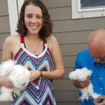 Janaye and Uncle Jimmy with Amanda's weird chickens at Thanksgiving