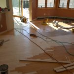 The hardwood floors being extended into new dining room and other places it wasn't before
