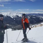 The boys at the top of A-basin with Keystone to the right beyond and Breckenridge on each side of Eric's helmet.