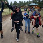 Scout summer camp. The troop celebrates winning the big relay race!