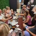 The whole gang waiting on a slow dinner w/ Tripp, Tierney and their 2 babes