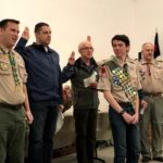 Alex surrounded by other Eagle scouts of all ages